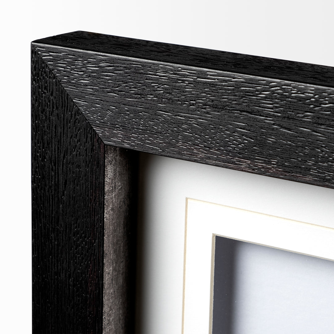 Close-up of a black wooden picture frame corner