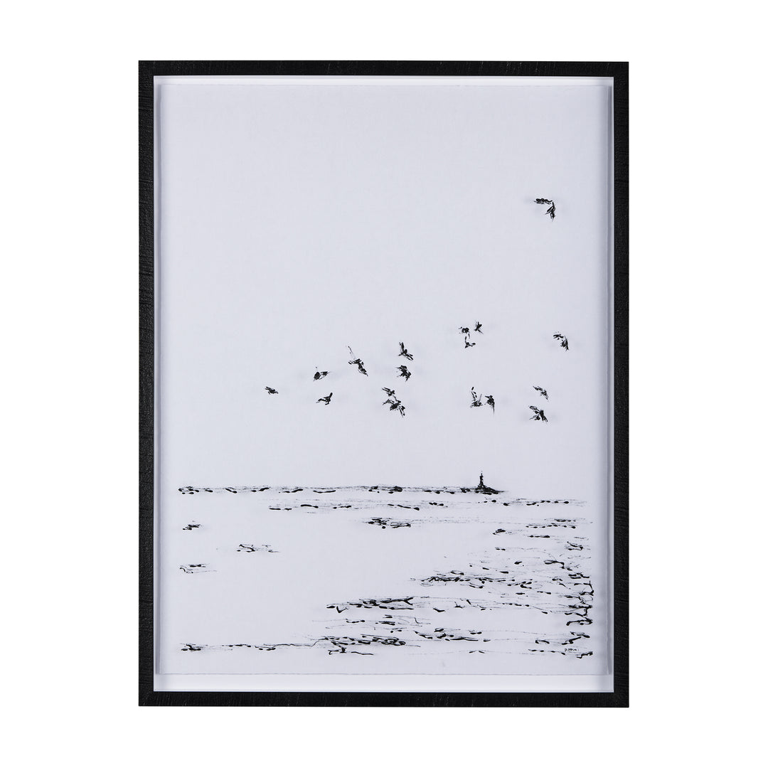Framed black and white artwork of birds flying over water.