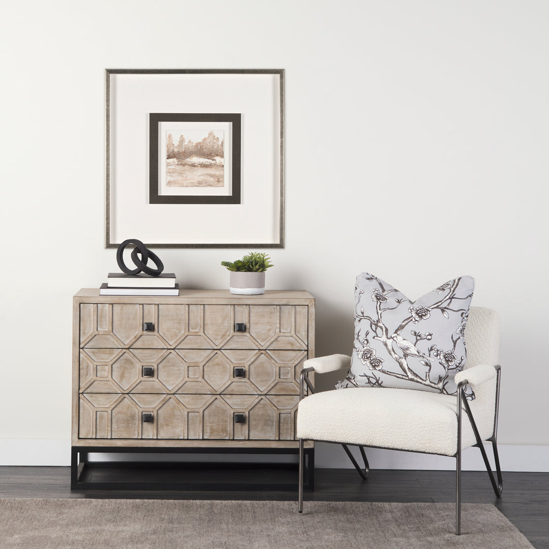 Living room with a wooden sideboard, chair, and decorative items.