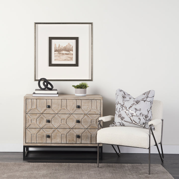 Living room with a wooden sideboard, chair, and decorative items.
