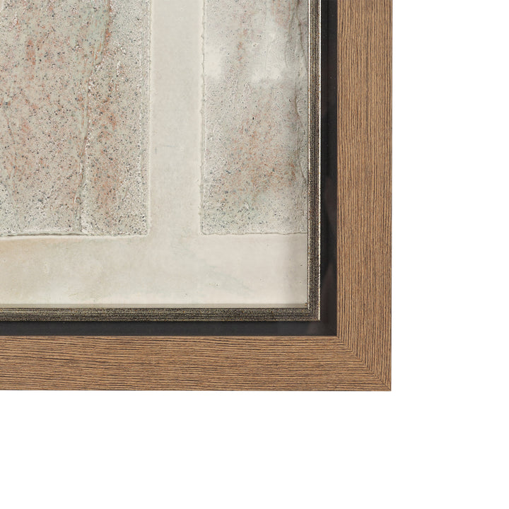 Close-up of a wooden picture frame with a textured wall background