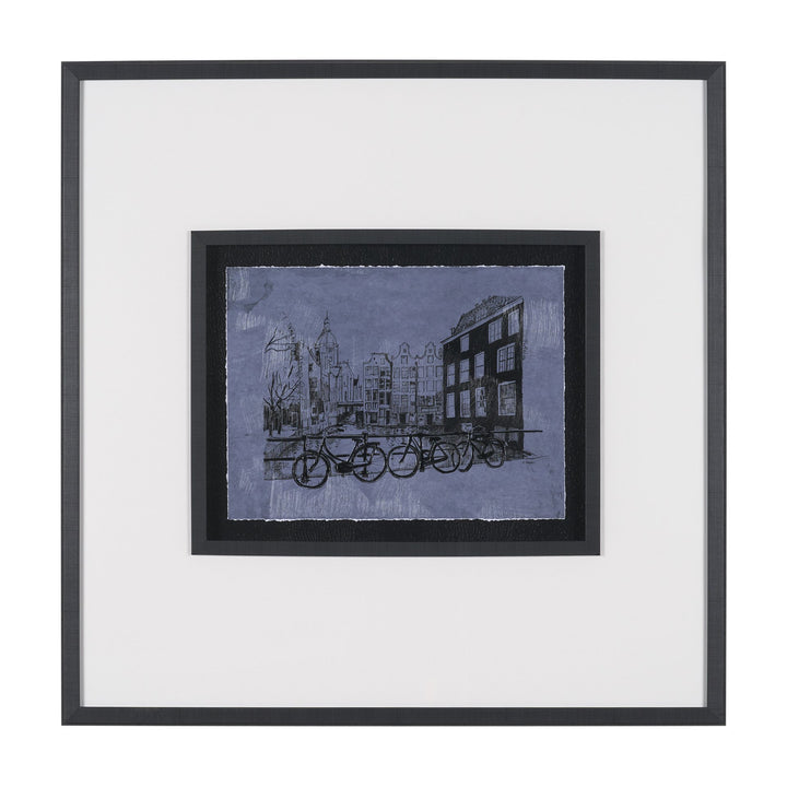 Framed artwork of a cityscape with bicycles on a blue background