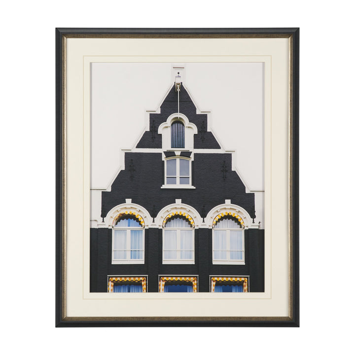 Framed artwork of a building with decorative elements on a white background