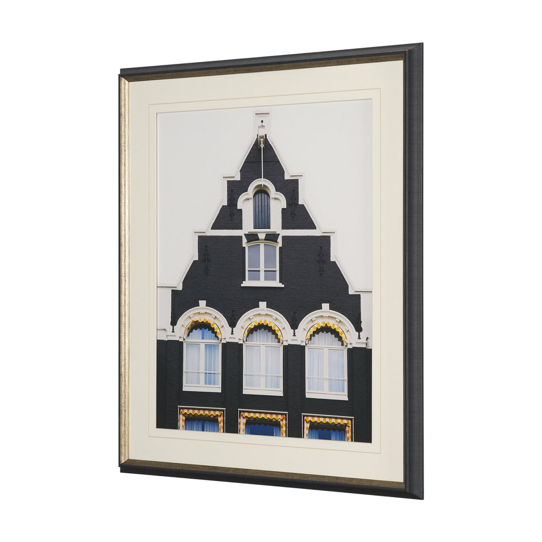 Framed artwork of a building with decorative elements on a white background