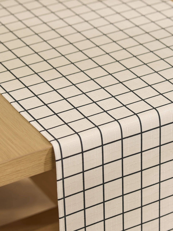 Grid-patterned tablecloth on a wooden table