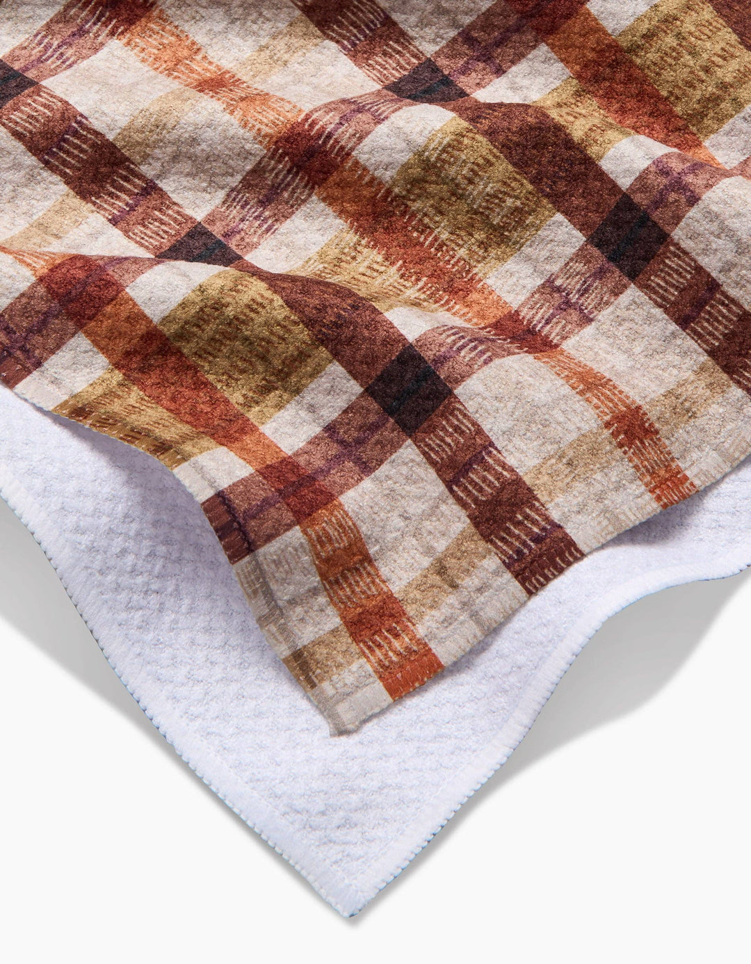 fall plaid tea towel with burnt orange, brown, and burgundy