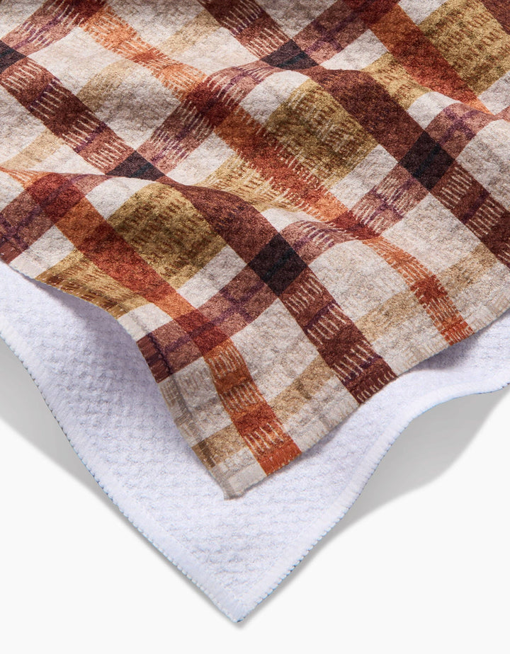 fall plaid tea towel with burnt orange, brown, and burgundy