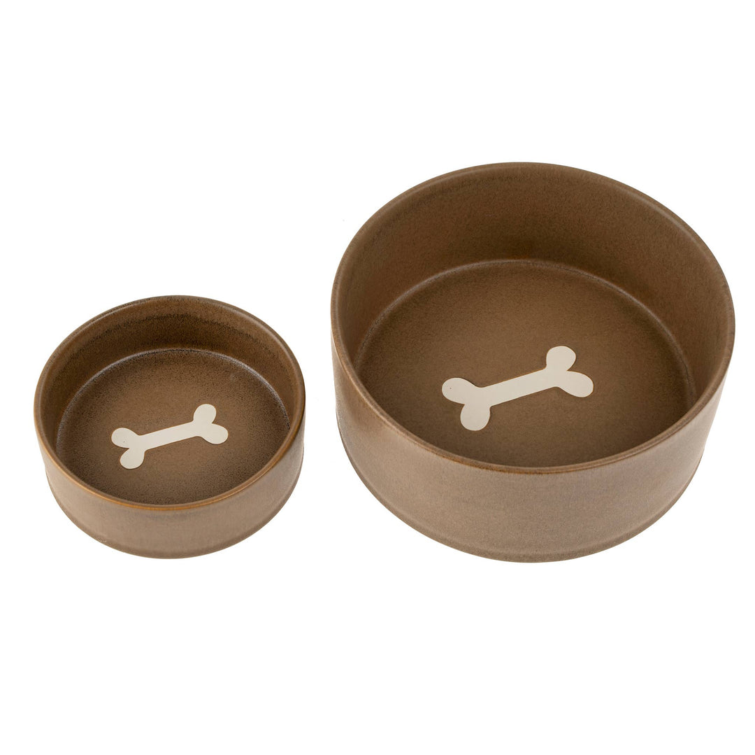 Two brown ceramic bowls with white bone designs on a white background