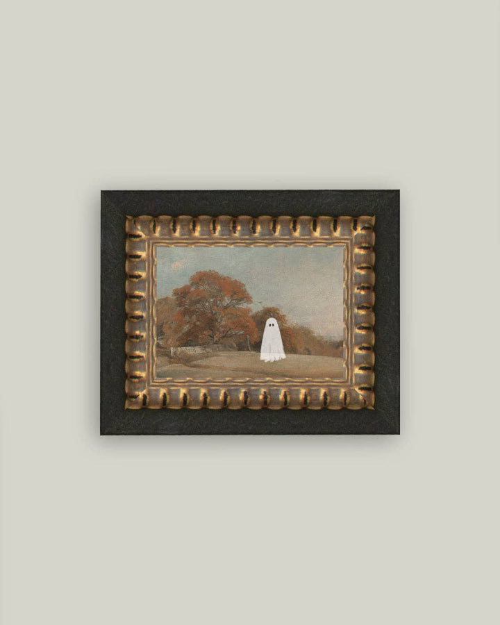 Framed artwork of a ghostly figure in a park setting on a plain wall.