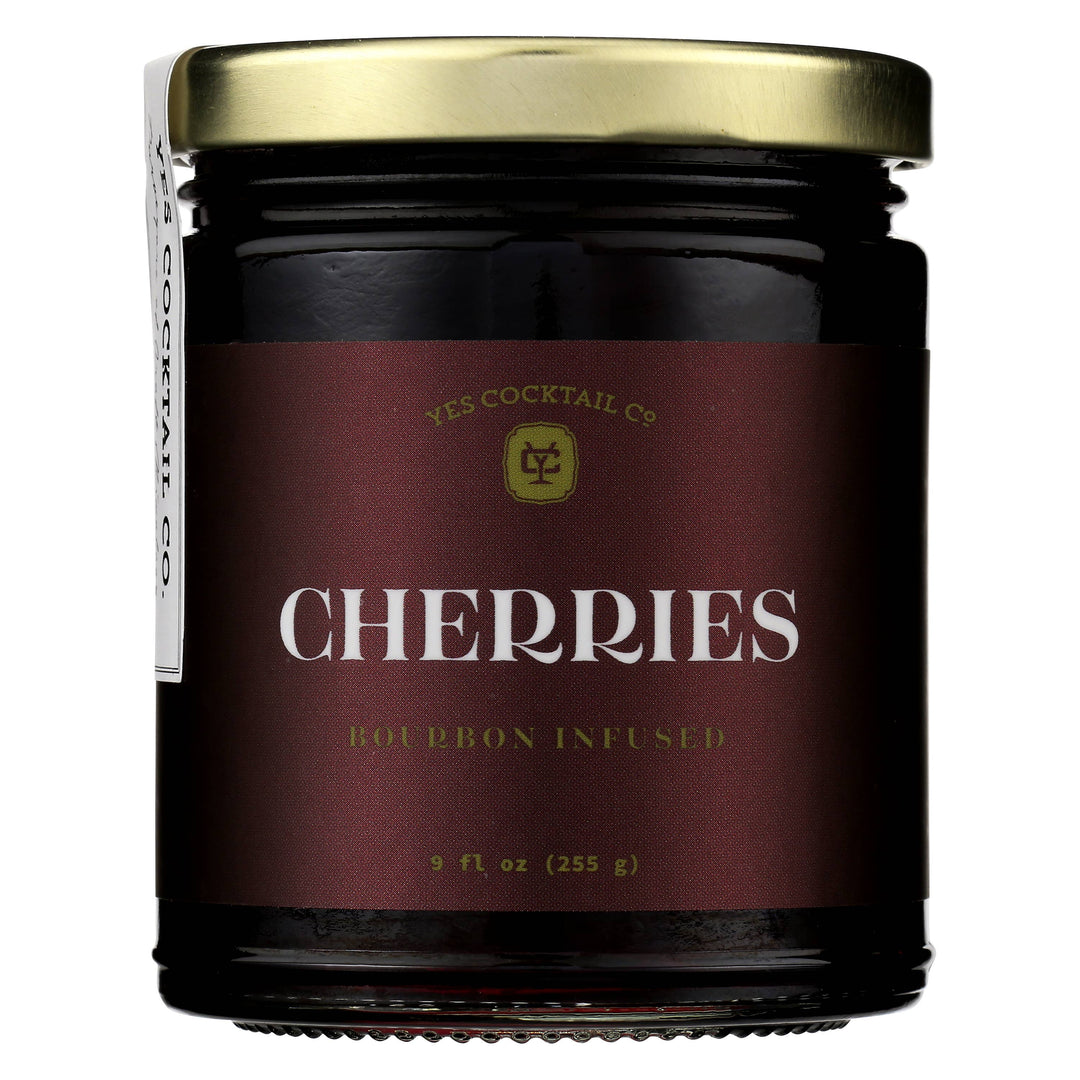 Jar of bourbon-infused cherries with a maroon label on a white background