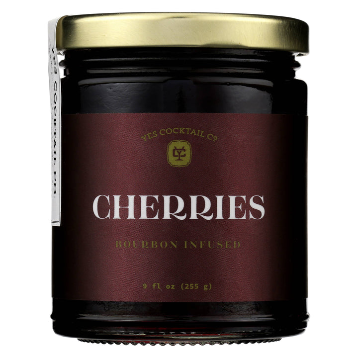 Jar of bourbon-infused cherries with a maroon label on a white background