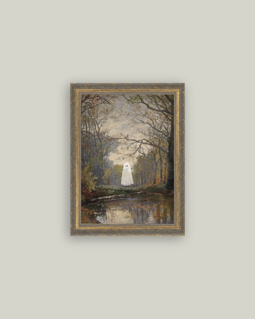 Framed artwork of a ghostly figure in a forest with a lake on a light gray wall.