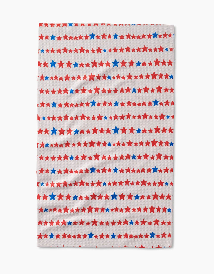 Fabric with red, white, and blue star pattern on a white background
