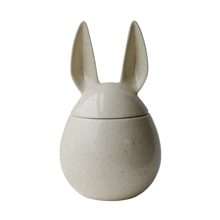 Ceramic rabbit-shaped container on a white background