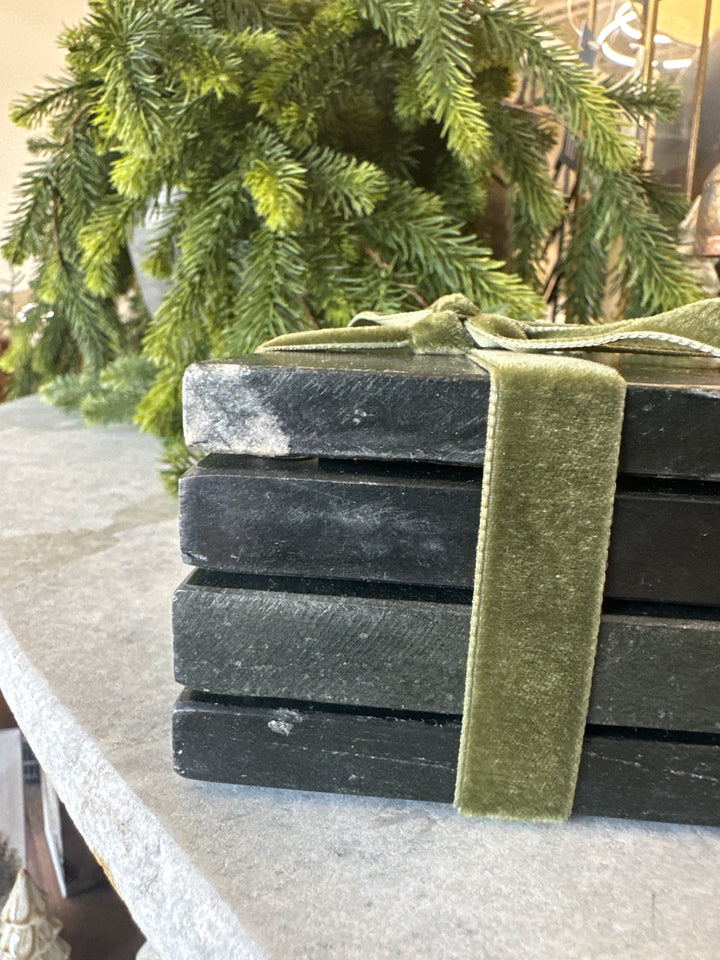 set of four black marble coasters