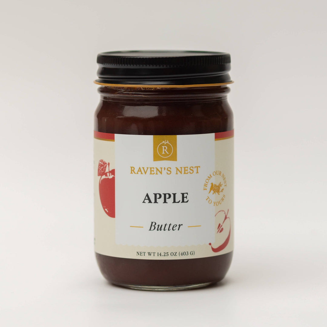 Jar of Raven's Nest Apple Butter on a white background