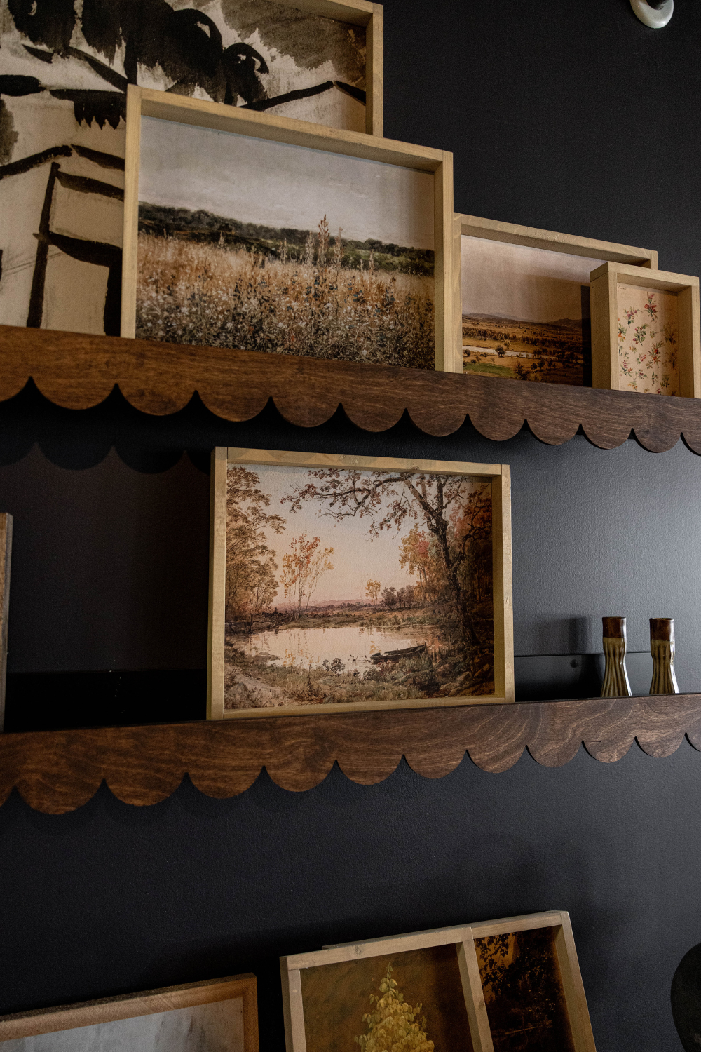 wooden scallop edged trim on ledge shelves