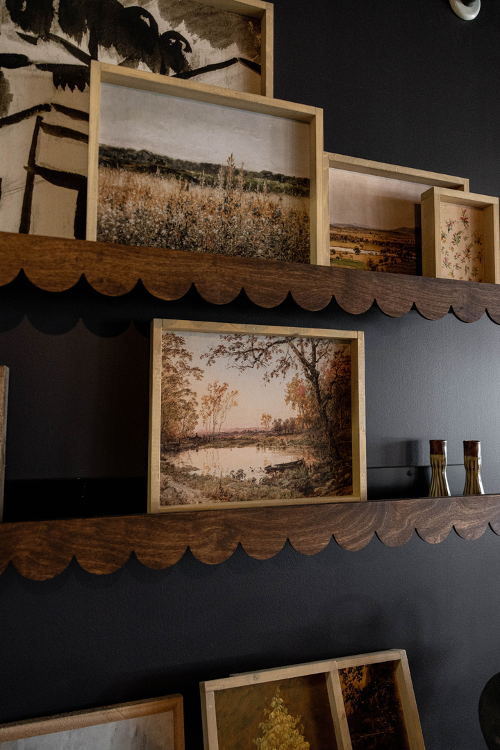 wooden scallop edged trim on ledge shelves