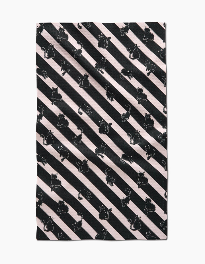 towel with black cat pattern on diagonal striped background