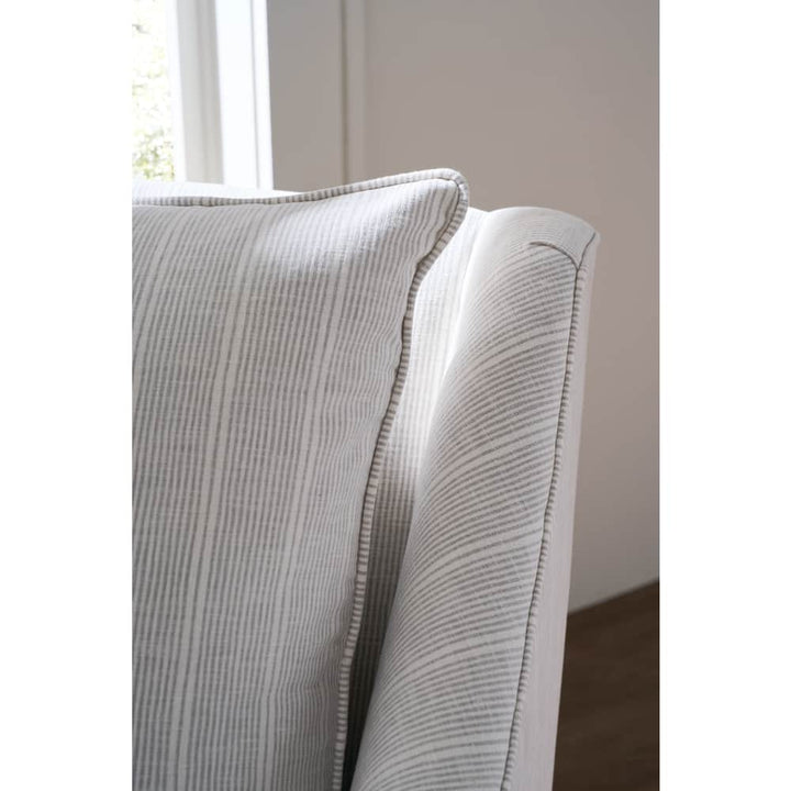 ivory striped swivel armchair with cushions