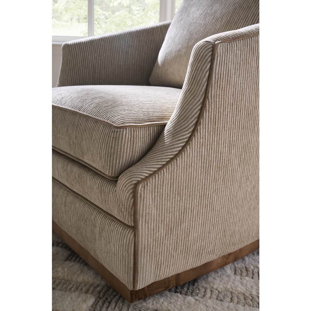 beige striped  swivel armchair with cushions