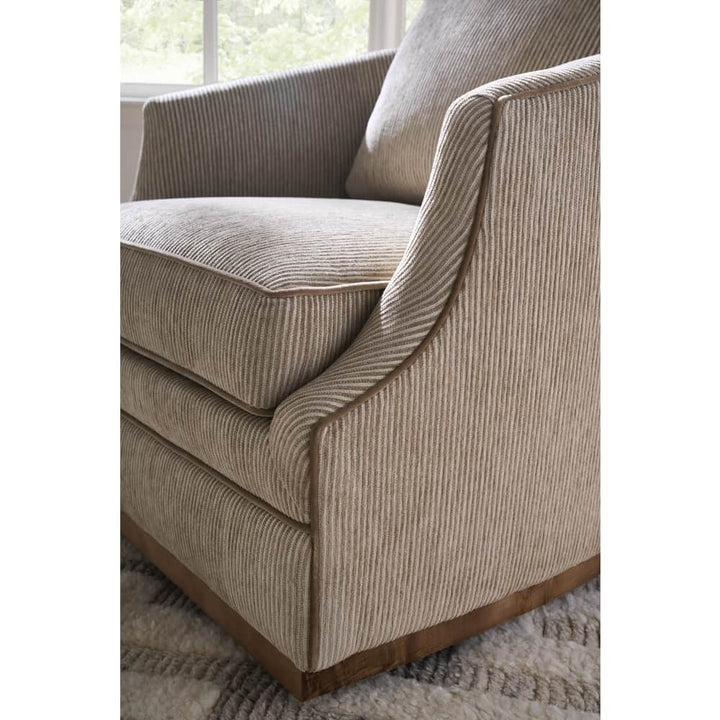 beige striped  swivel armchair with cushions
