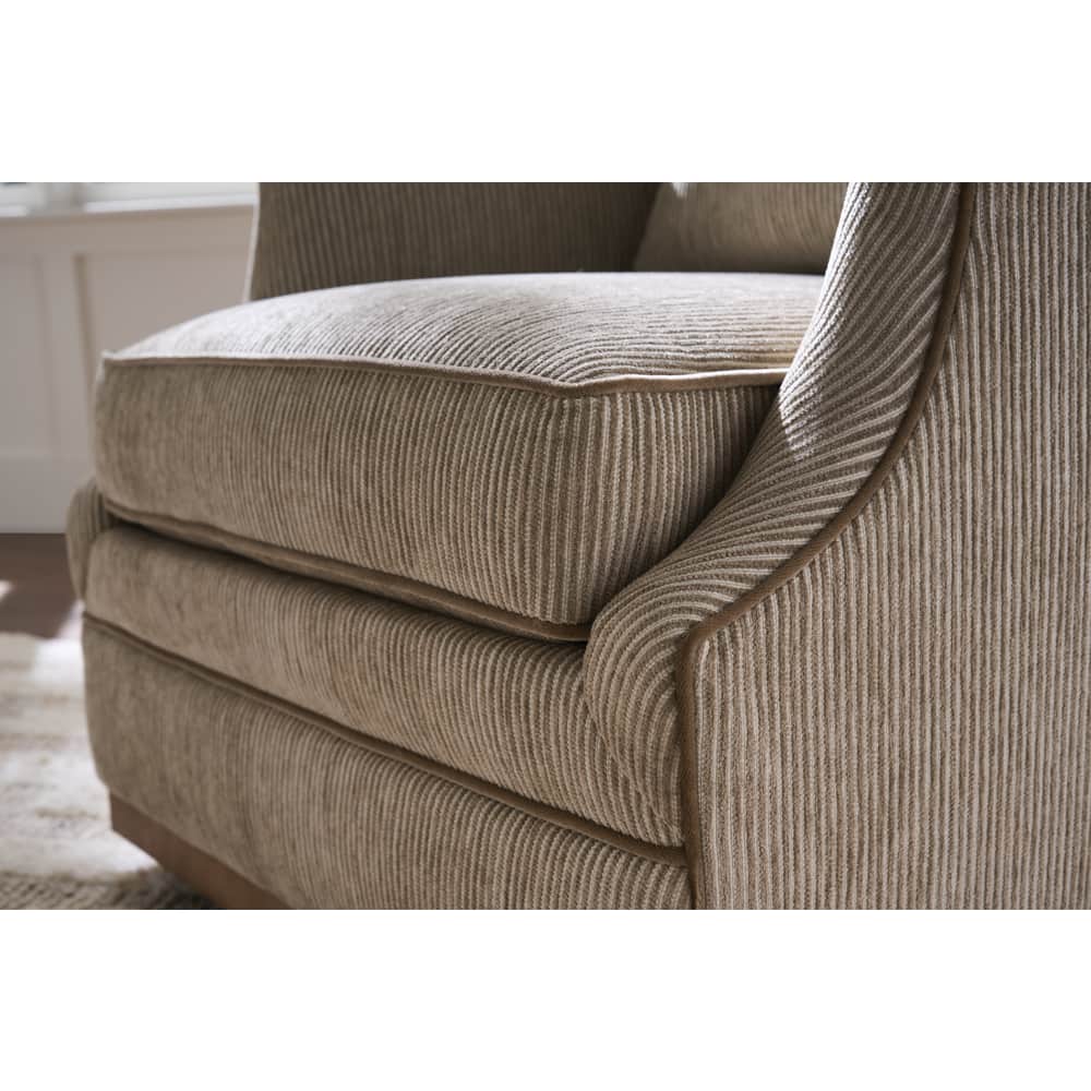 beige striped  swivel armchair with cushions
