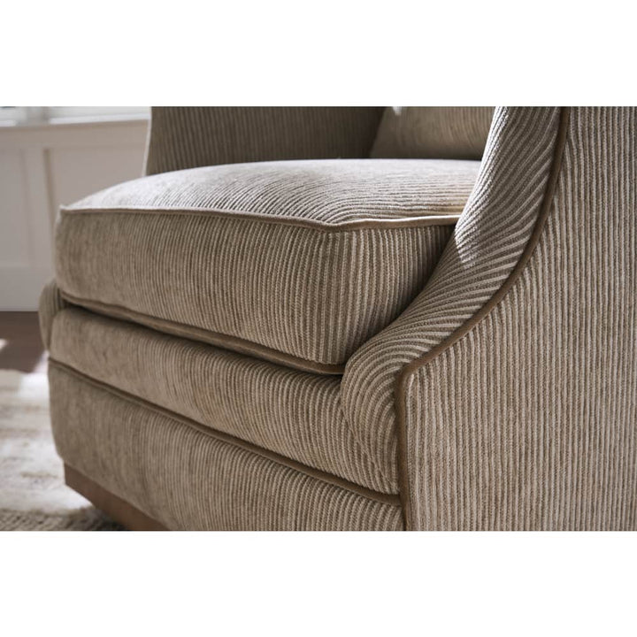 beige striped  swivel armchair with cushions