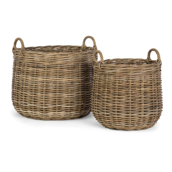 Two wicker baskets with handles on a white background