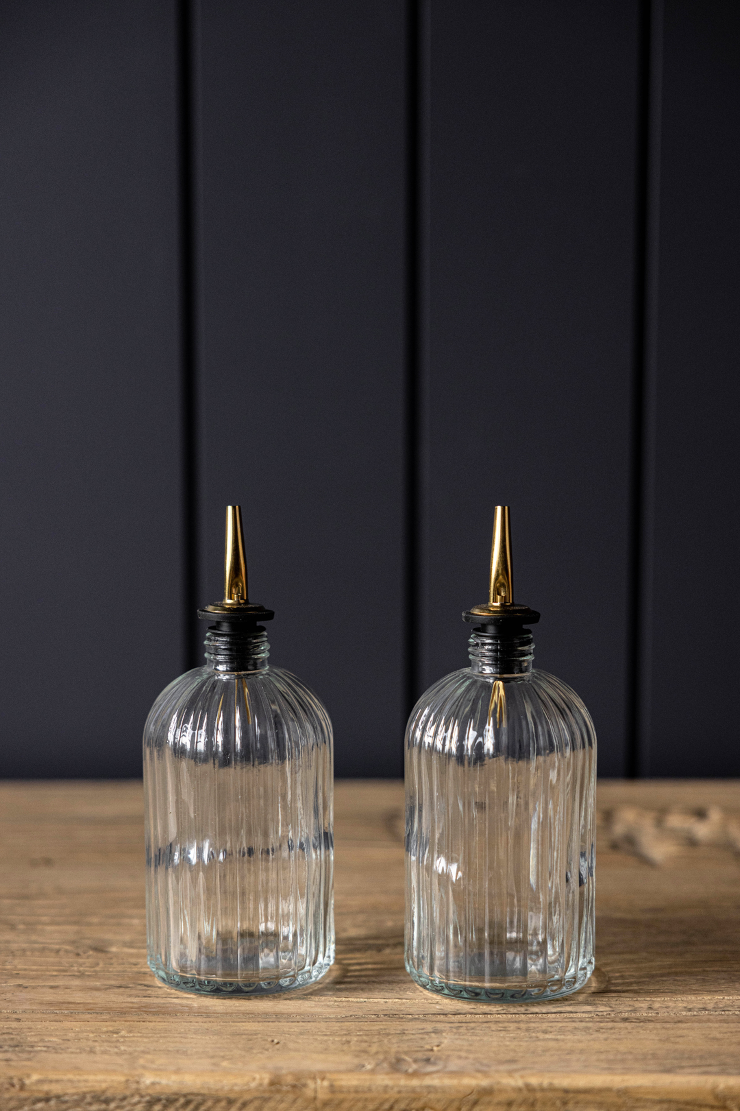 clear glass olive oil bottles with gold spout
