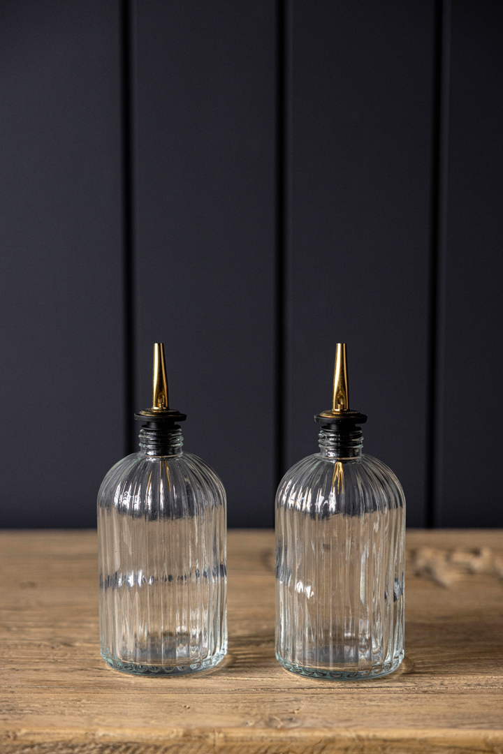 clear glass olive oil bottles with gold spout