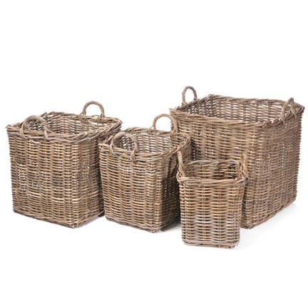 Set of four square wicker baskets with handles on a white background
