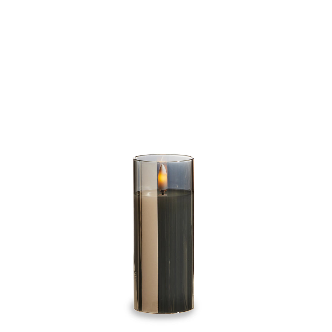 Candle in a decorative holder on a white background
