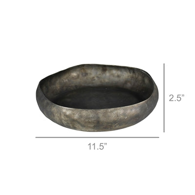 A round metal tray with a hand hammered texture and an antiqued finish.