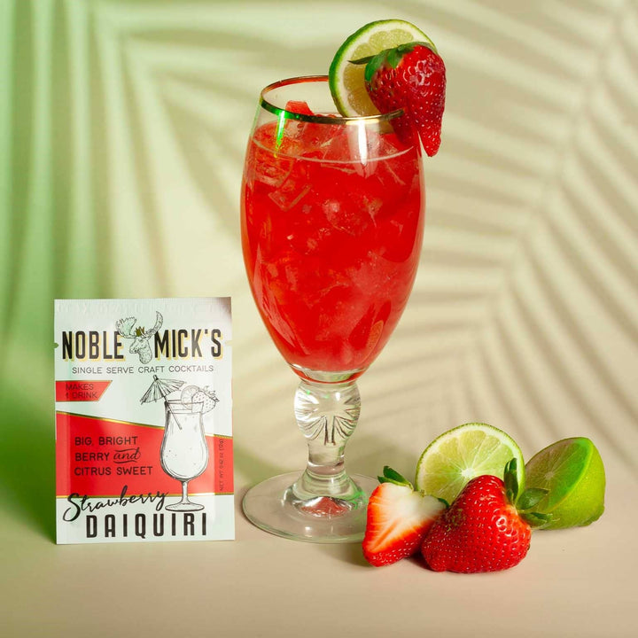 Strawberry daiquiri in a glass with a Noble Mick's Strawberry Daiquiri single serve mixer