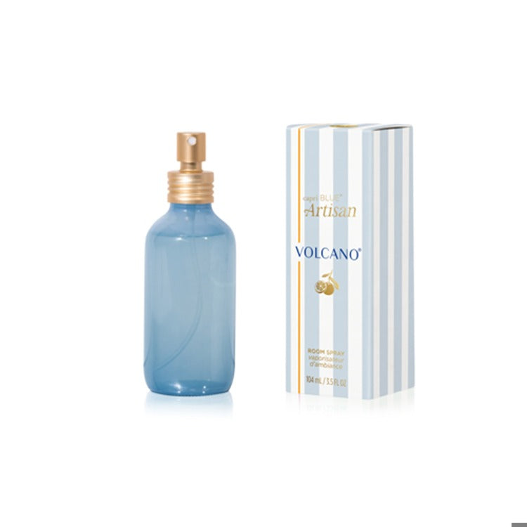 Blue volcano scented room spray bottle with gold cap and matching box on a white background