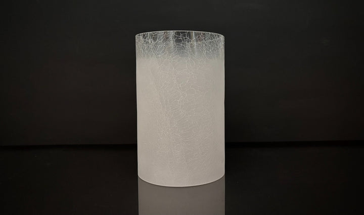 Cylindrical white textured vase on a black background