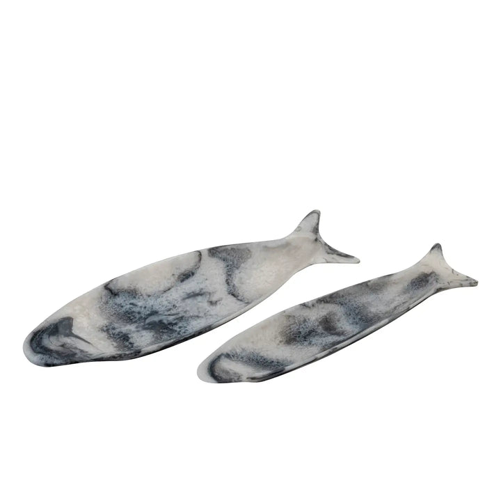 Two marble-patterned fish-shaped cutting boards on a white background
