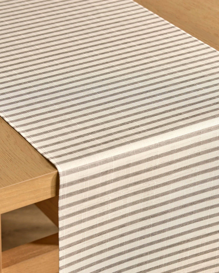 Striped table runner on a wooden table