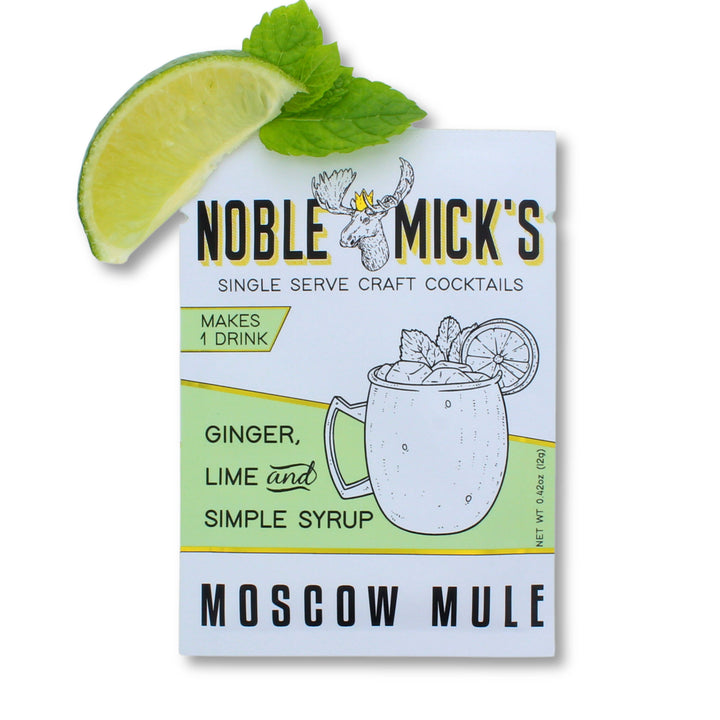 Noble Mick's Moscow Mule cocktail mix package with a lime wedge and mint leaf 