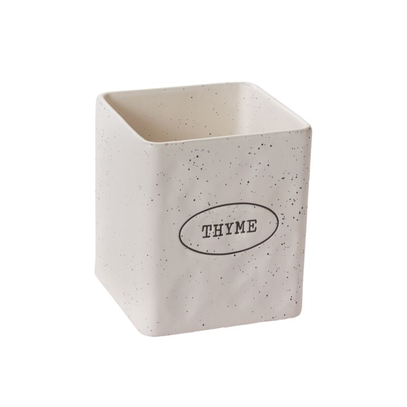 Speckled ceramic container with 'Thyme' text on a white background