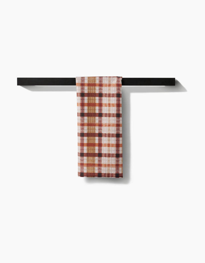 fall plaid tea towel with burnt orange, brown, and burgundy