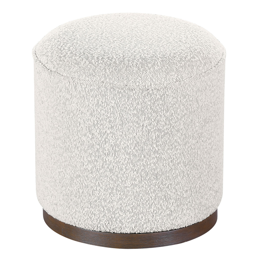 Round ottoman with textured white cushion and wooden base on a white background