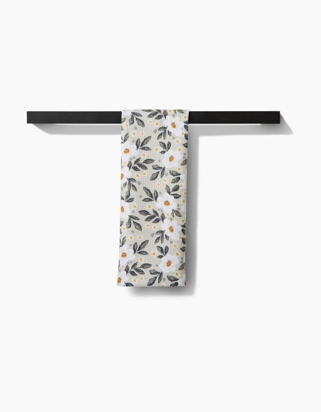 Floral patterned geometry towel with small flowers and leaves on a light background