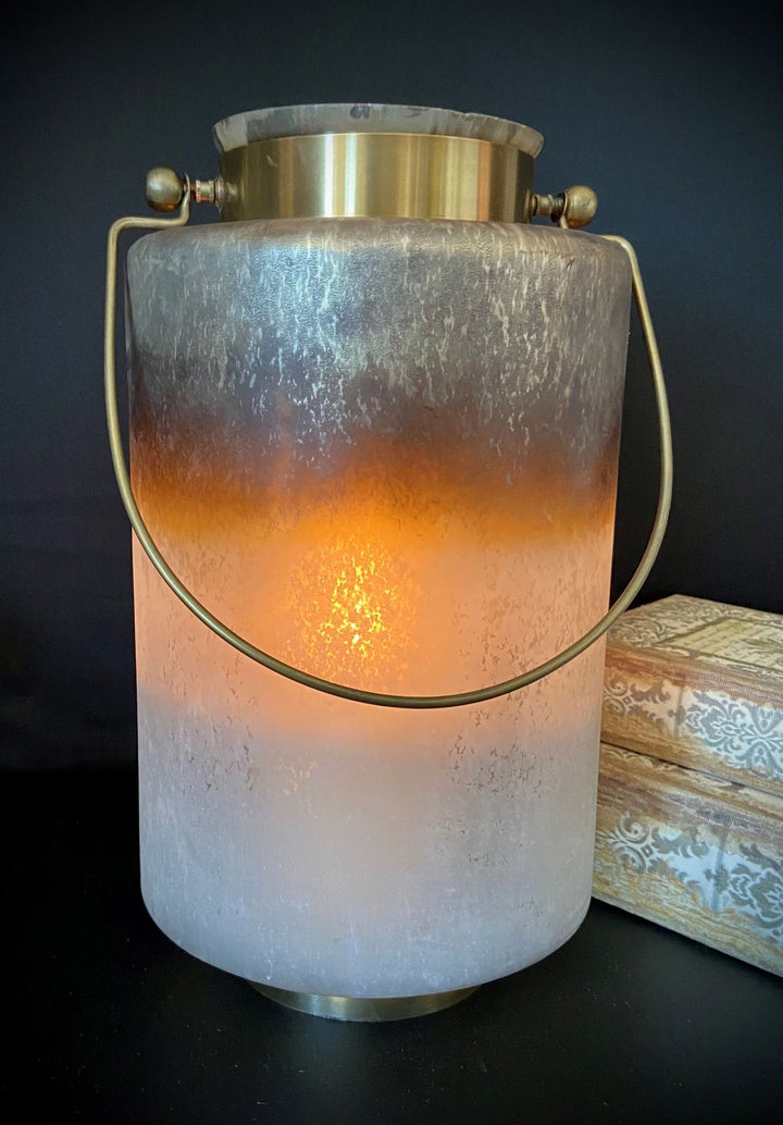 Decorative lantern with a warm glow on a dark background