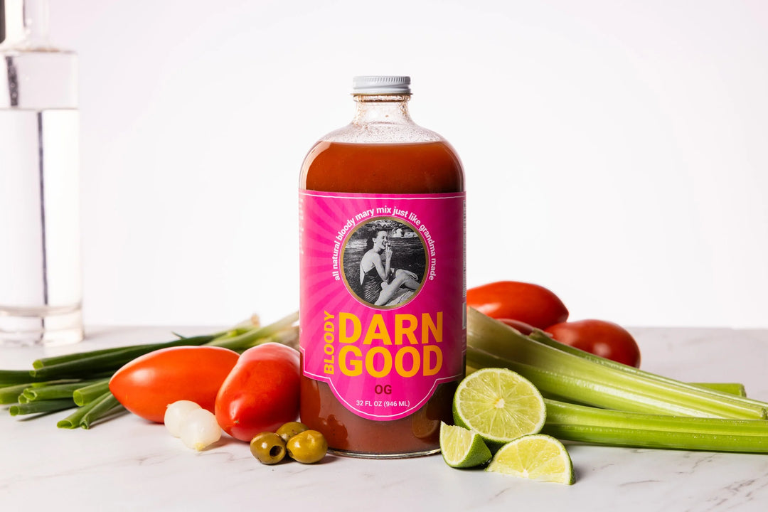 bloody mary mix surrounded by vegetables ingredients