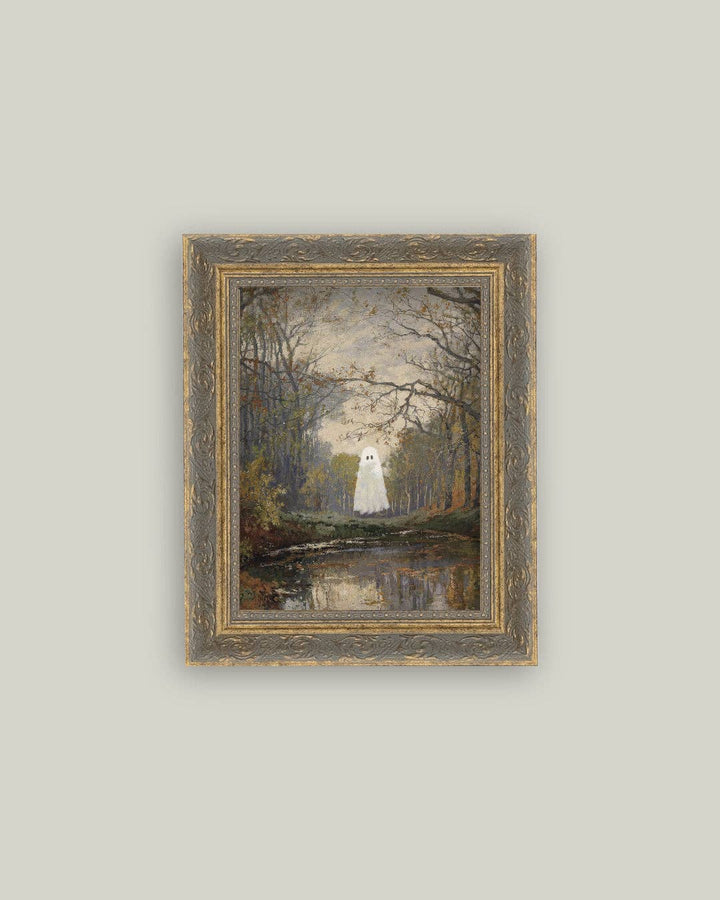 Framed painting of a ghostly figure in a forest setting on a light gray wall.