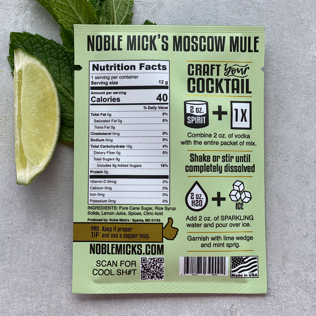Noble Mick's Moscow Mule cocktail mix package with lime wedge and mint leaves 