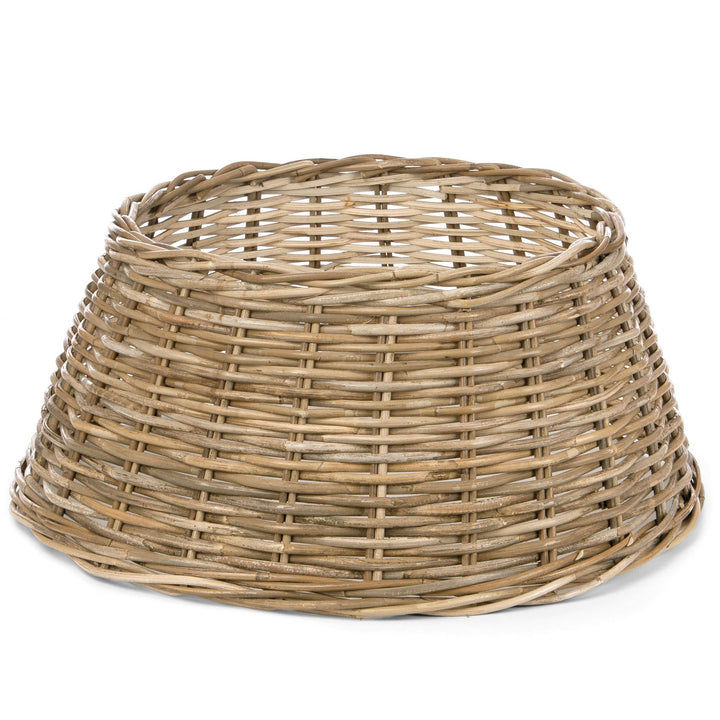 A natural woven wicker basket with a tapered, conical shape, shown on a plain white background.