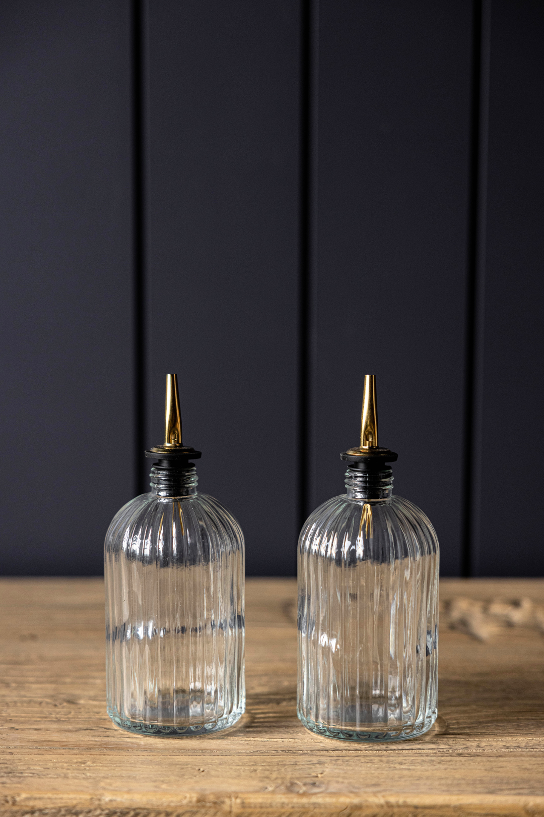 clear glass olive oil bottles with gold spout